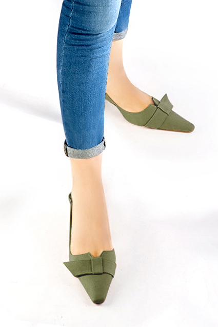 Women's khaki green elegant slingback heels, with a bow on the front. Tapered toe. Medium spool heels - Worn view